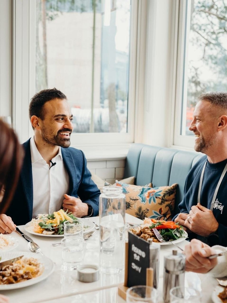 Shiv Haria with clients over lunch discussing property investments